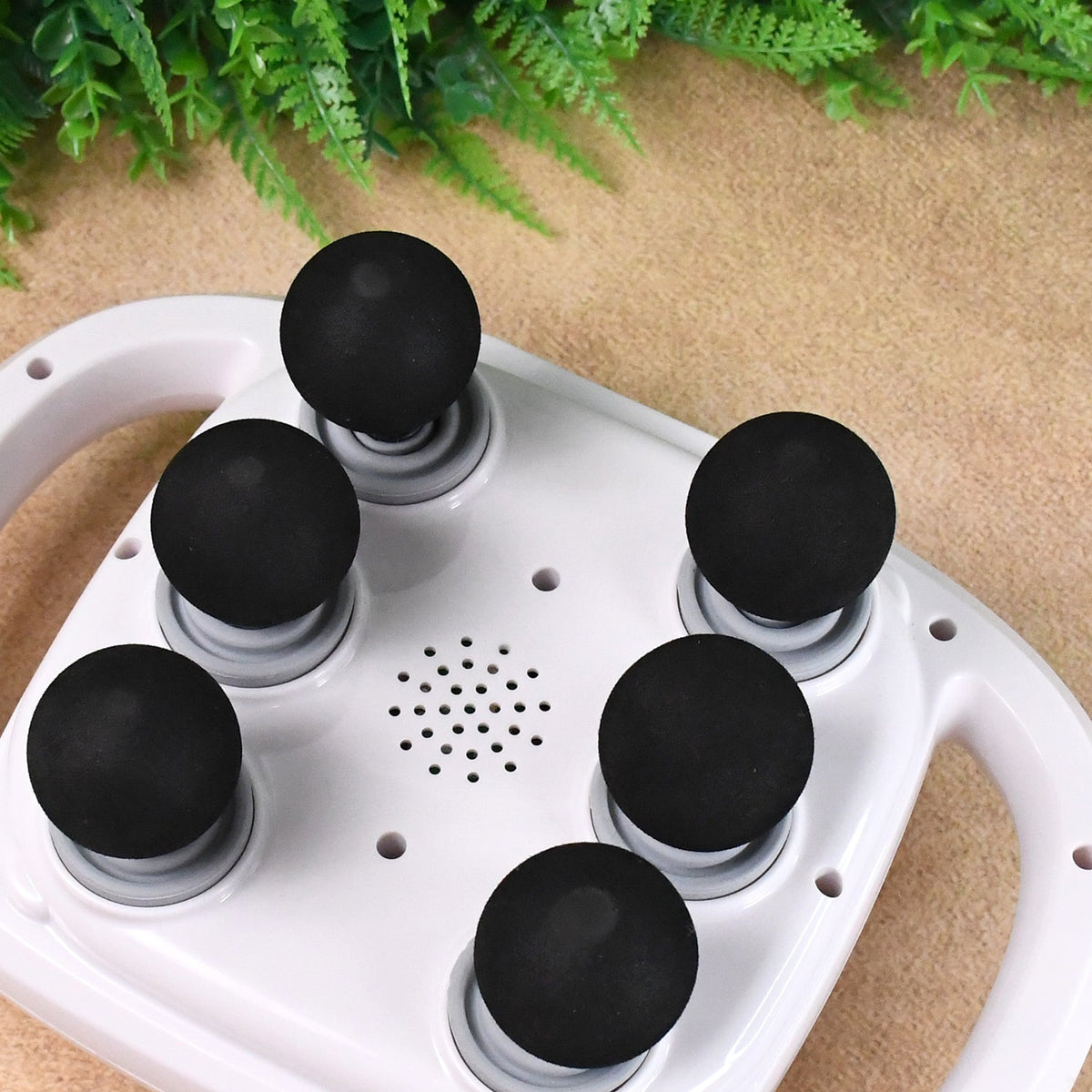 Nuvara Pulse deep tissue massage gun with six interchangeable heads